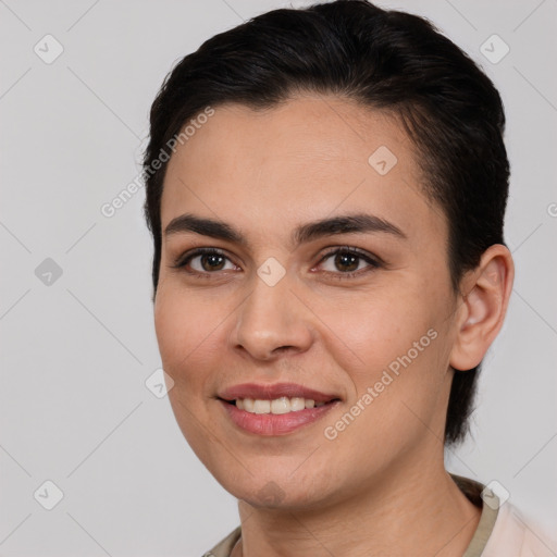 Joyful white young-adult female with medium  brown hair and brown eyes