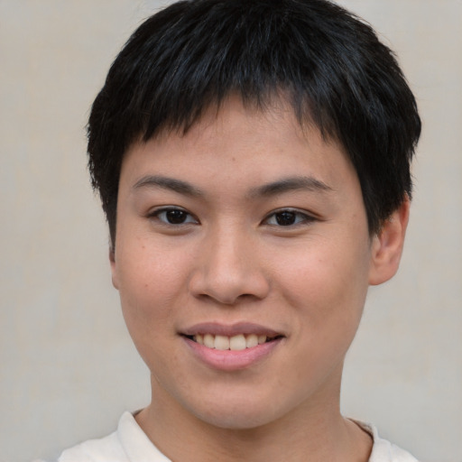 Joyful asian young-adult female with short  brown hair and brown eyes