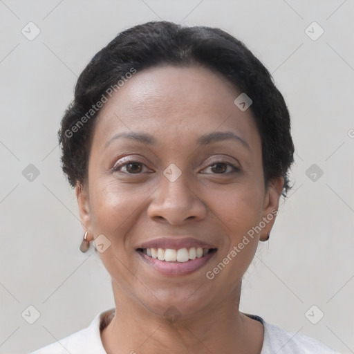 Joyful latino young-adult female with short  brown hair and brown eyes