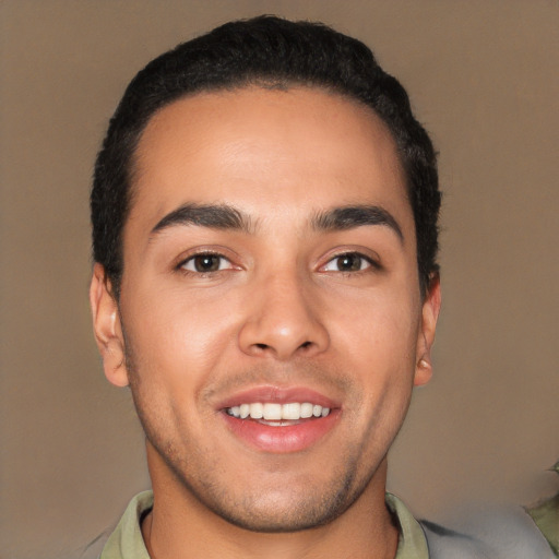 Joyful white young-adult male with short  black hair and brown eyes