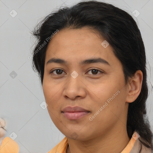 Joyful latino young-adult female with medium  brown hair and brown eyes