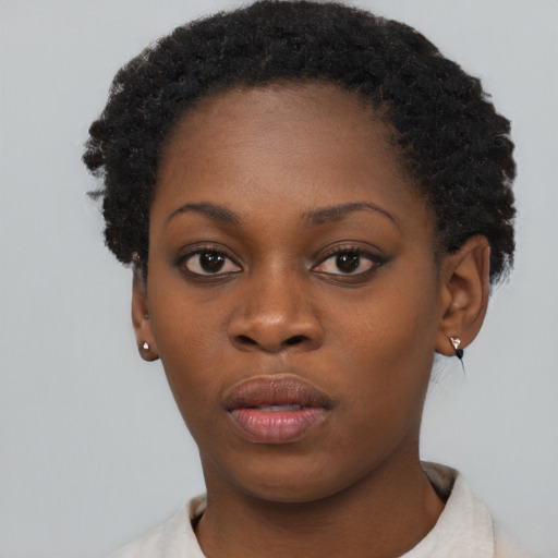 Neutral black young-adult female with short  brown hair and brown eyes