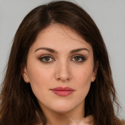 Neutral white young-adult female with long  brown hair and brown eyes