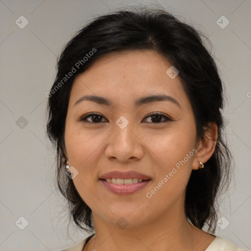 Joyful latino young-adult female with medium  brown hair and brown eyes