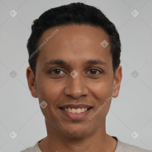 Joyful latino young-adult male with short  black hair and brown eyes