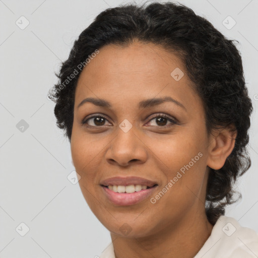 Joyful latino adult female with short  brown hair and brown eyes