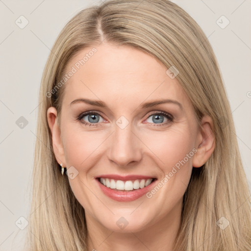 Joyful white young-adult female with long  brown hair and blue eyes