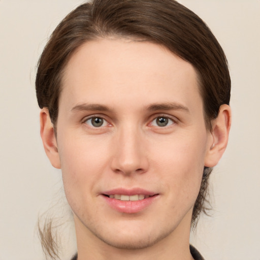 Joyful white young-adult male with medium  brown hair and brown eyes