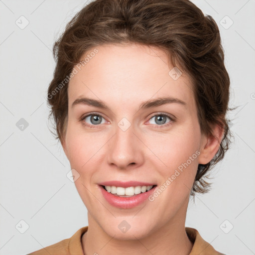 Joyful white young-adult female with short  brown hair and green eyes