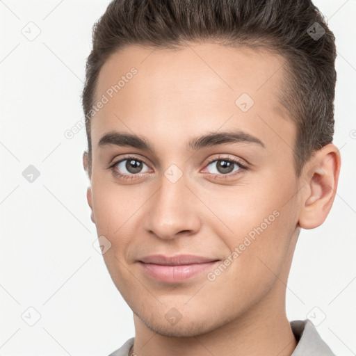 Joyful white young-adult male with short  brown hair and brown eyes