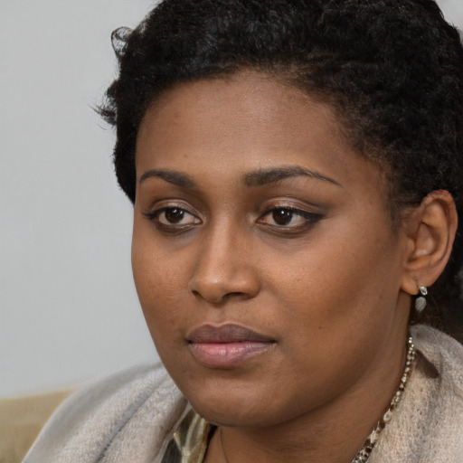 Neutral black young-adult female with short  brown hair and brown eyes