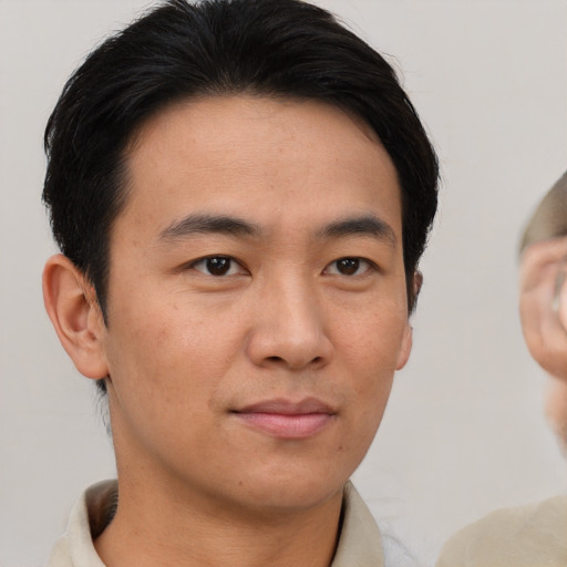 Neutral asian young-adult male with short  brown hair and brown eyes