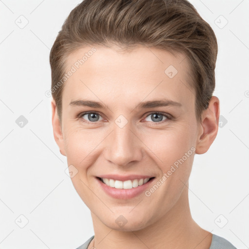 Joyful white young-adult female with short  brown hair and grey eyes