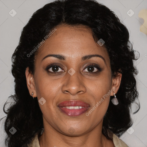 Joyful black adult female with medium  brown hair and brown eyes