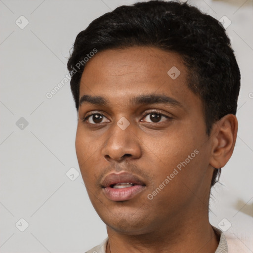 Neutral black young-adult male with short  black hair and brown eyes