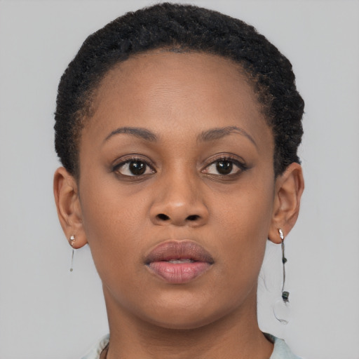 Neutral black young-adult female with short  brown hair and brown eyes