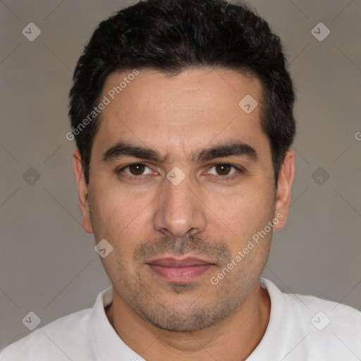 Joyful white young-adult male with short  black hair and brown eyes