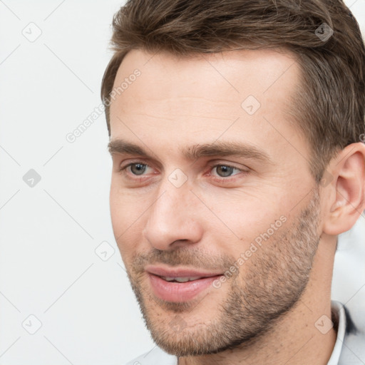 Joyful white young-adult male with short  brown hair and brown eyes