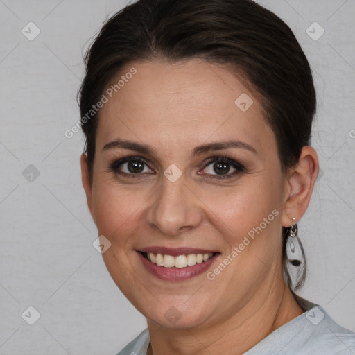 Joyful white adult female with short  brown hair and brown eyes