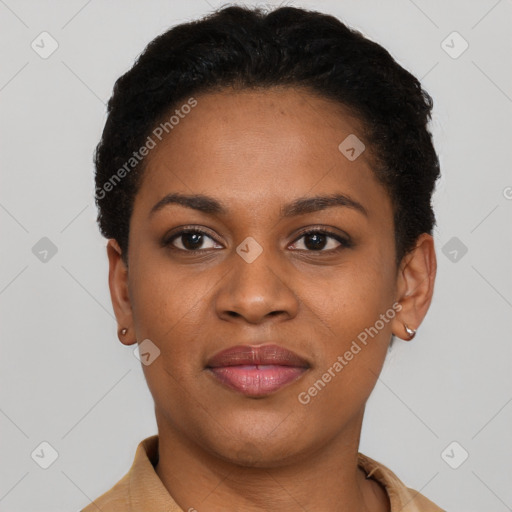 Joyful black young-adult female with short  black hair and brown eyes