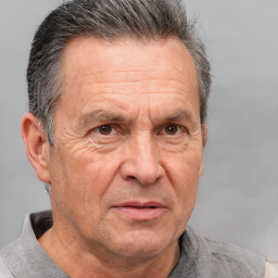 Neutral white middle-aged male with short  gray hair and brown eyes