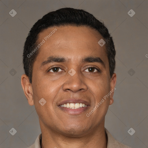 Joyful latino young-adult male with short  black hair and brown eyes