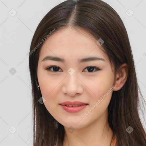 Joyful asian young-adult female with long  brown hair and brown eyes