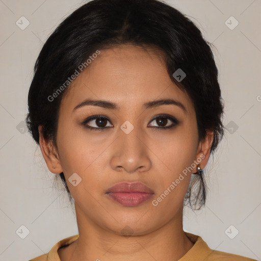 Joyful latino young-adult female with medium  black hair and brown eyes