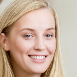 Joyful white young-adult female with long  brown hair and blue eyes