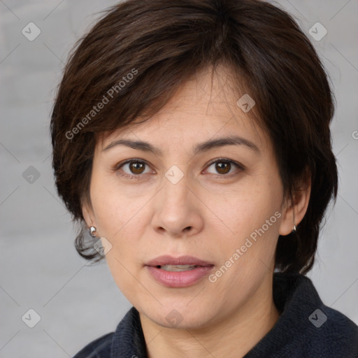 Joyful white adult female with medium  brown hair and brown eyes