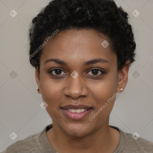 Joyful black young-adult female with short  black hair and brown eyes