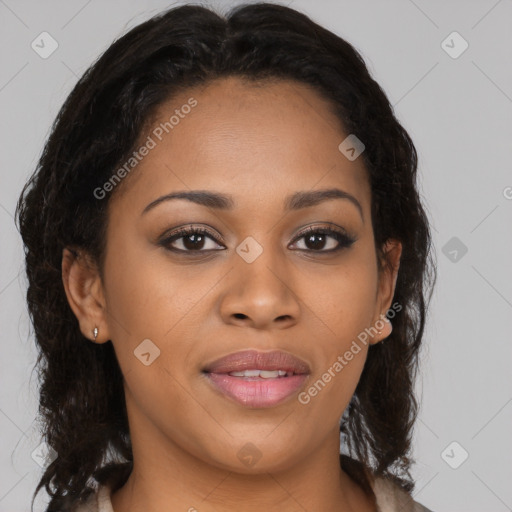 Joyful black young-adult female with long  brown hair and brown eyes