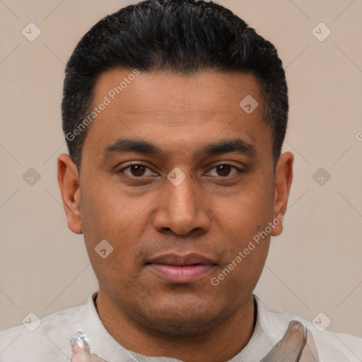 Joyful latino young-adult male with short  black hair and brown eyes