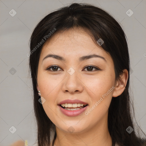 Joyful asian young-adult female with long  brown hair and brown eyes