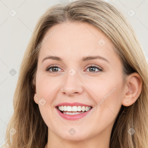 Joyful white young-adult female with long  brown hair and blue eyes