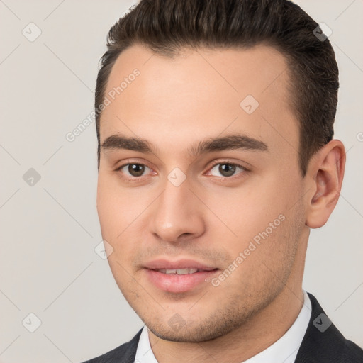 Neutral white young-adult male with short  brown hair and brown eyes