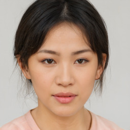 Neutral asian young-adult female with medium  brown hair and brown eyes