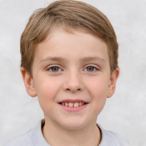 Joyful white child male with short  brown hair and grey eyes