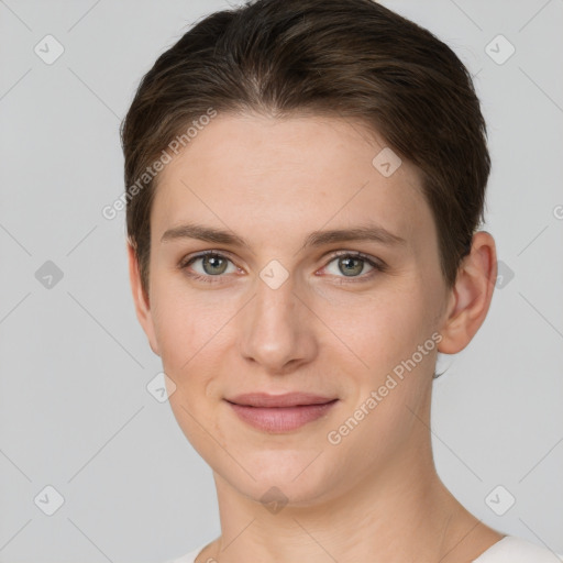 Joyful white young-adult female with short  brown hair and grey eyes