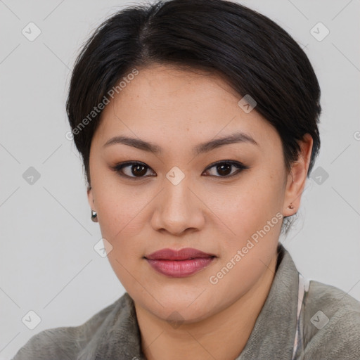 Joyful asian young-adult female with short  brown hair and brown eyes