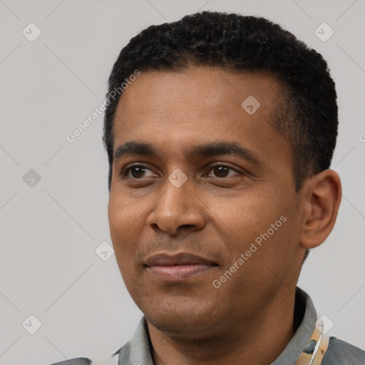 Neutral latino young-adult male with short  black hair and brown eyes