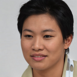 Joyful asian young-adult female with short  brown hair and brown eyes