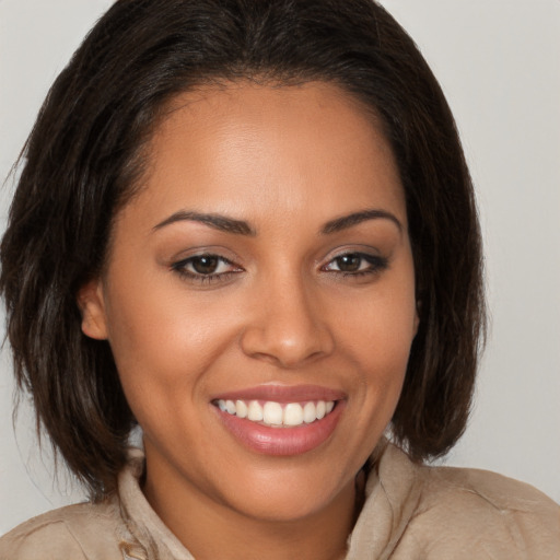 Joyful white young-adult female with medium  brown hair and brown eyes