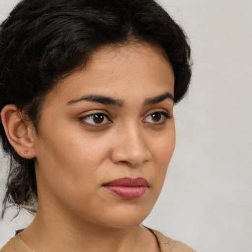 Neutral latino young-adult female with medium  brown hair and brown eyes