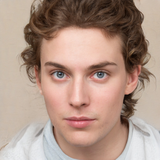 Neutral white young-adult male with medium  brown hair and blue eyes