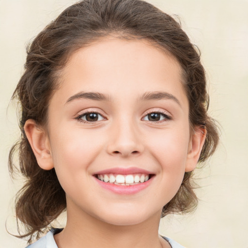 Joyful white child female with medium  brown hair and brown eyes