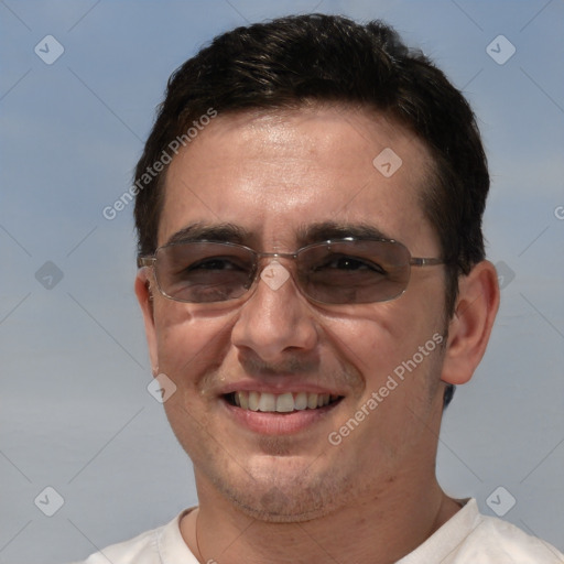 Joyful white adult male with short  brown hair and brown eyes