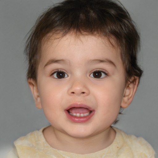 Joyful white child male with short  brown hair and brown eyes