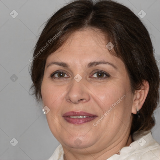 Joyful white adult female with medium  brown hair and brown eyes