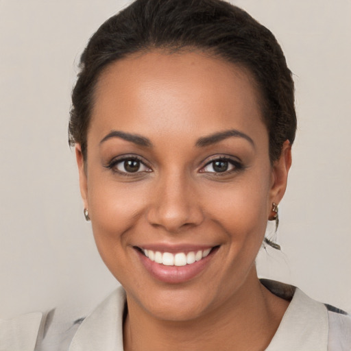 Joyful white young-adult female with short  brown hair and brown eyes